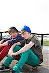 Boys Sitting on Skateboards, Mannheim, Baden-Wurttemberg, Germany