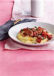 Sausage with Tomatoes on Polenta