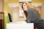 Businesswoman using computer at desk