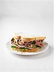 Ham and cucumber sandwich on plate