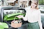 Woman carrying basket of vegetables