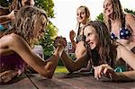 Two girls arm wrestling