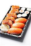 Sushi food on tray against white background