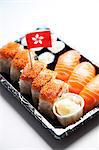 Sushi food on tray with Hong Kong flag against white background