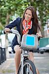 Young businesswoman commuting by her bicycle