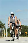 Cyclists cycling on road