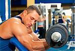 Man with weight training equipment on sport gym club