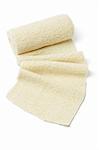 Roll of Elastic Crepe Bandage on White Background