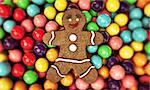 christmas gingerbread man sleeping on gum balls bed