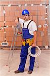 Electrician at work site standing