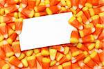 A blank message card in the candy corn.