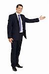 Photo of a handsome young businessman pointing to something.