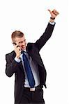 Happy business man showing thumb up while talking on the phone