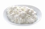 natural cottage cheese in a dish isolated on a white background