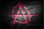 Punk letter A, symbol for freedom and/or anarchy sprayed on dark wall