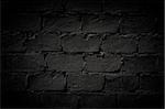 Dark brick wall, empty with copy space