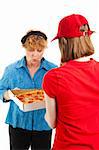 Happy woman inspects the pizza she's having delivered by a delivery girl.