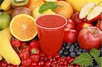 Freshly squeezed juice from red fruits in a cup