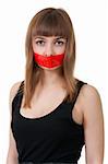 beautiful girl with her mouth sealed with red tape