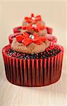 Delicious chocolate cupcakes in red