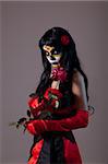 Sugar skull lady with red rose, Mexican Day of the Dead