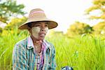 Portrait of a Myanmar woman with thanaka powdered face who works in the field