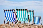 Deck chairs on Brighton beachin summer, England, UK