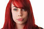 Beautiful red haired woman pouting over white background