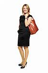 Studio shot of attractive  woman in a black dress with a bag. Portrait of businesswoman isolated on white background.