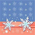 Bright Christmas card with snowflakes on a blue and red background