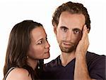 Sympathetic woman looking at man holding his head