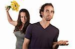 Woman ready to throw flowers at naive white male