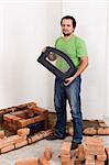 Building a traditional stove for heating - worker at construction site