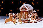 Christmas gingerbread cookie house and deers - holidays food setting