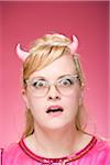 Portrait of Woman Wearing Devil Horns and Vintage Eyeglasses