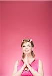 Portrait of Woman Wearing Devil Horns Looking Up and Praying