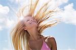 Smiling woman tossing her hair