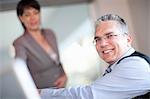 Businessman smiling in meeting