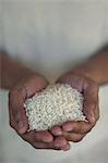 Close up of hands holding rice