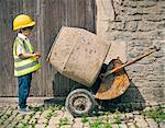 Boy playing construction with mixer