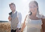 Newlywed couple walking outdoors