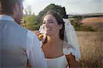 Newlywed couple having champagne