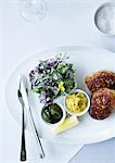 Plate of fish with herb salad