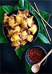 Plate of deep fried dumplings with sauce