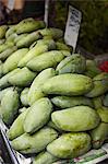 Green mango for sale at market