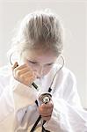 Girl playing doctor with stethoscope
