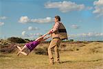 Father and daughter playing outdoors