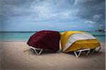 Covered Beach Chairs and Storm Clouds on Baby Beach, Seroe Colorado, Aruba, Lesser Antilles, Dutch Antilles