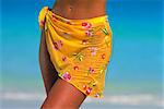 Close-Up of Woman Wearing Sarong On Beach