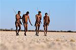 Bushman Hunters Walking Namibia, Africa